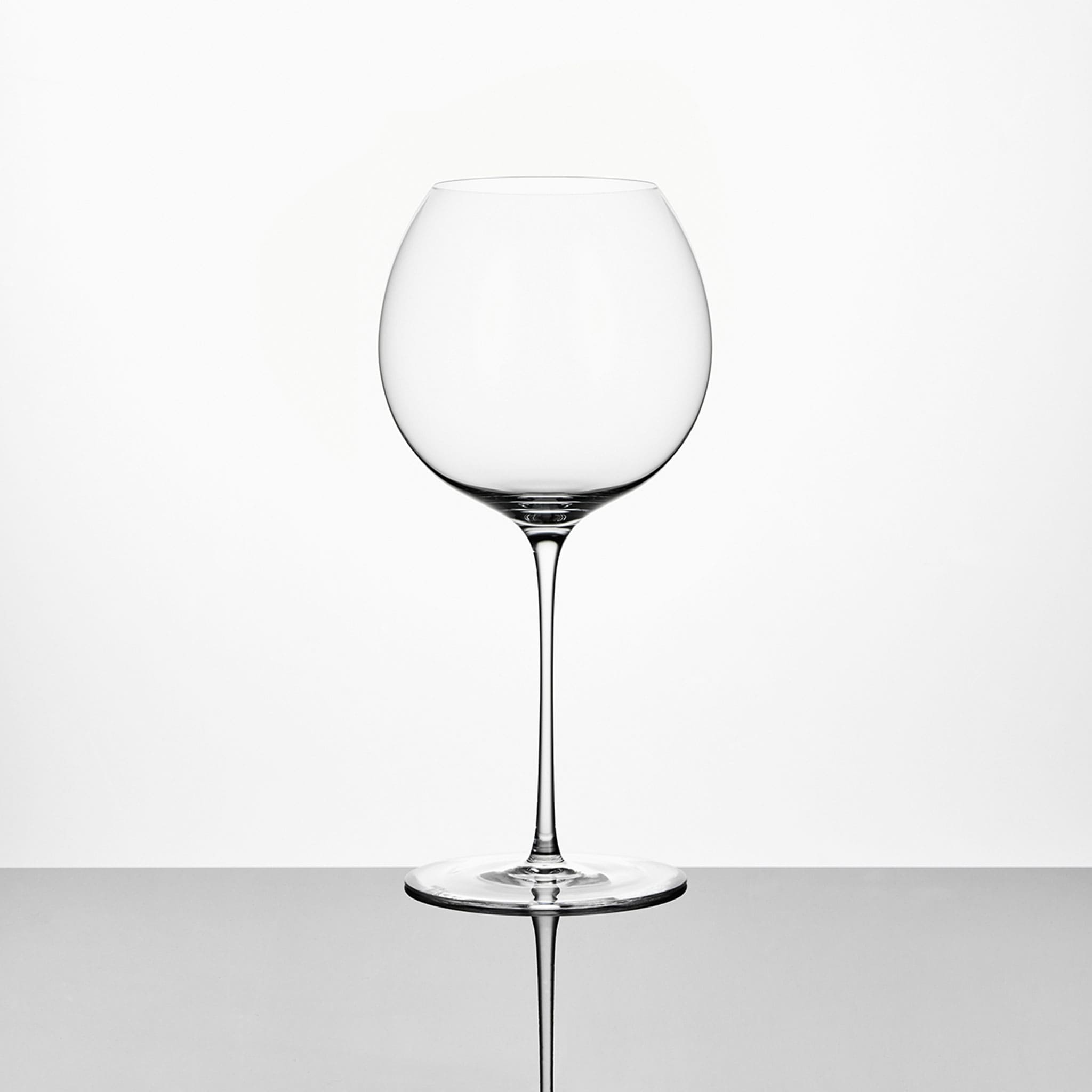 Wine tasting glass set in soft light with a golden ratio silhouette and refined crystal clarity