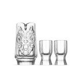 Year of the Dragon crystal baijiu set in soft light with a sculpted dragon decanter and faceted tasting cups
