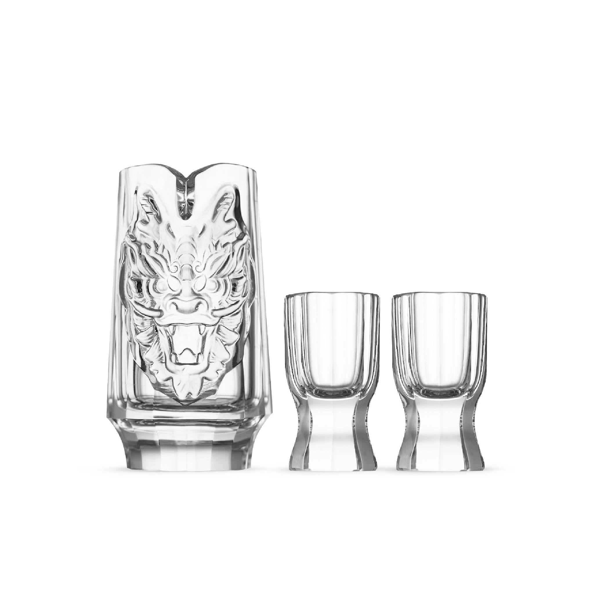 Year of the Dragon crystal baijiu set in soft light with a sculpted dragon decanter and faceted tasting cups