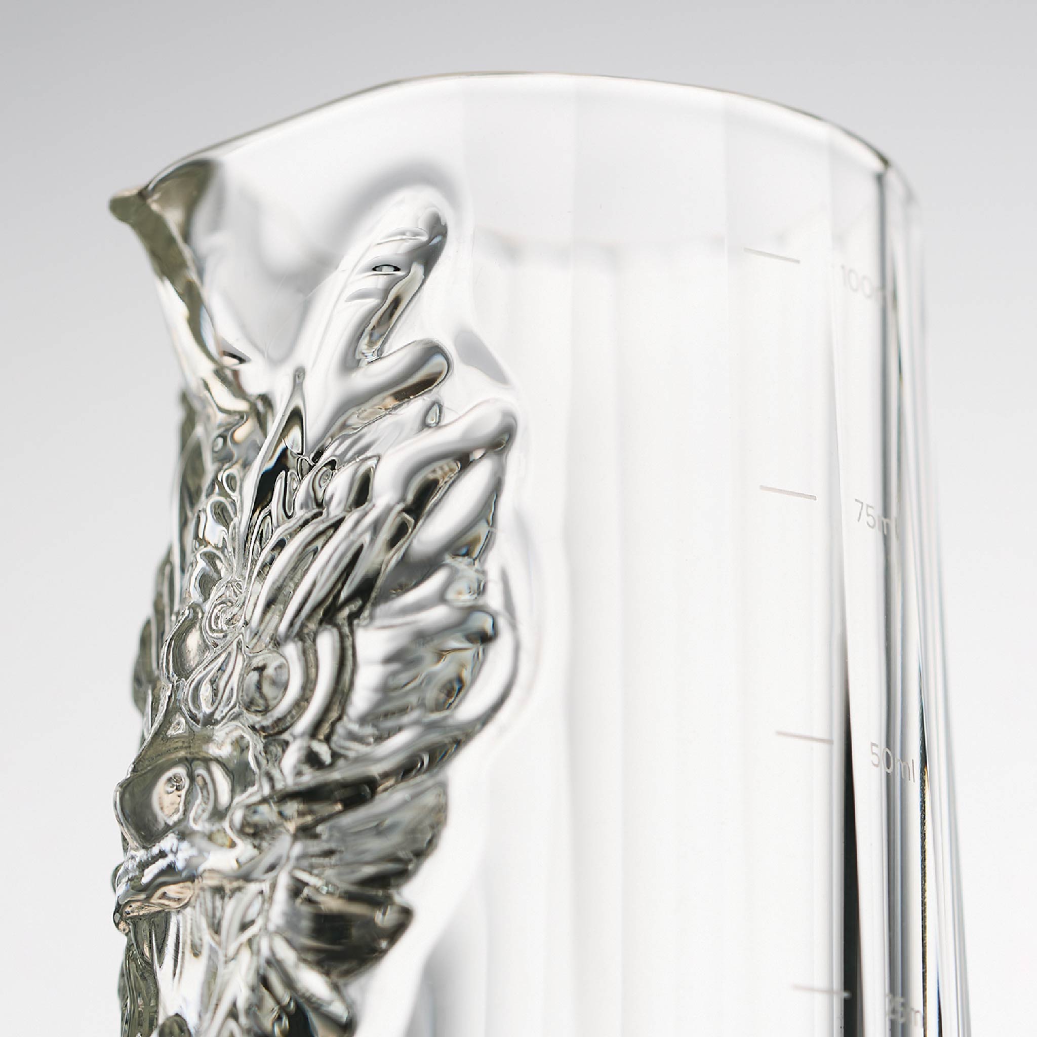 Close-up of dragon baijiu set showing sculpted dragon detail, polished crystal facets, and black K5 crystal finish