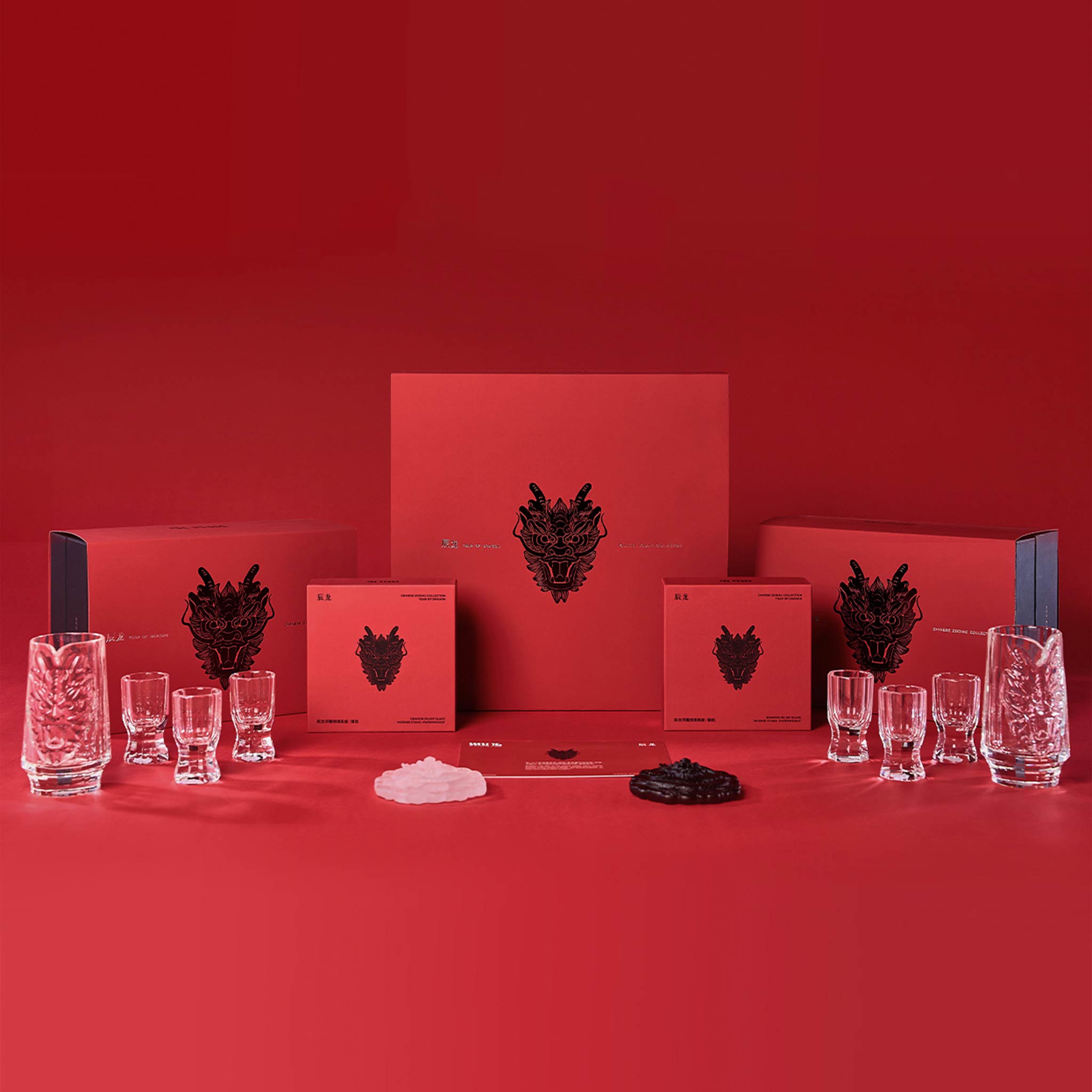 Chinese baijiu gift set styled for a quiet gathering with a sculptural dragon decanter and crystal cups